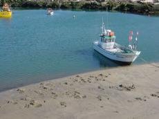 Areia revolvida com a apanha do marisco